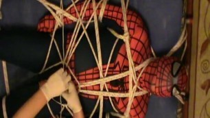 Restrained spiderman gets an enjoying