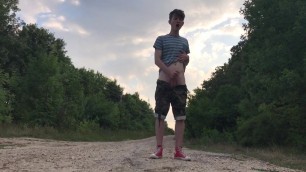 Teenager jerking off on a dusty road